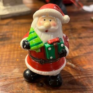 Ceramic Santa holds present